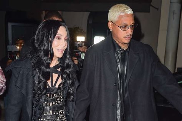 
Cher Flashes Ring in Party Photo with Boyfriend Alexander ‘AE’ Edwards: ‘Happy New Year, Daddy’ 